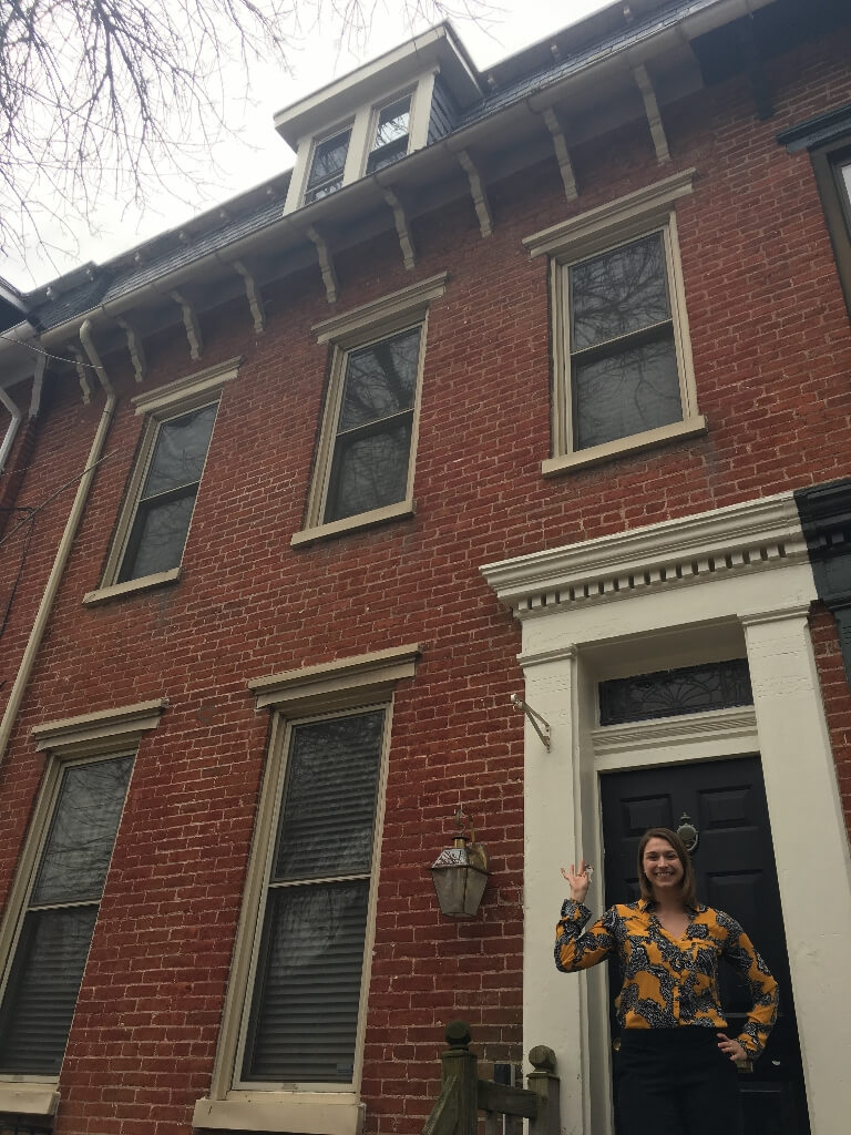 Image: Attorney Hynes standing in front of her new home